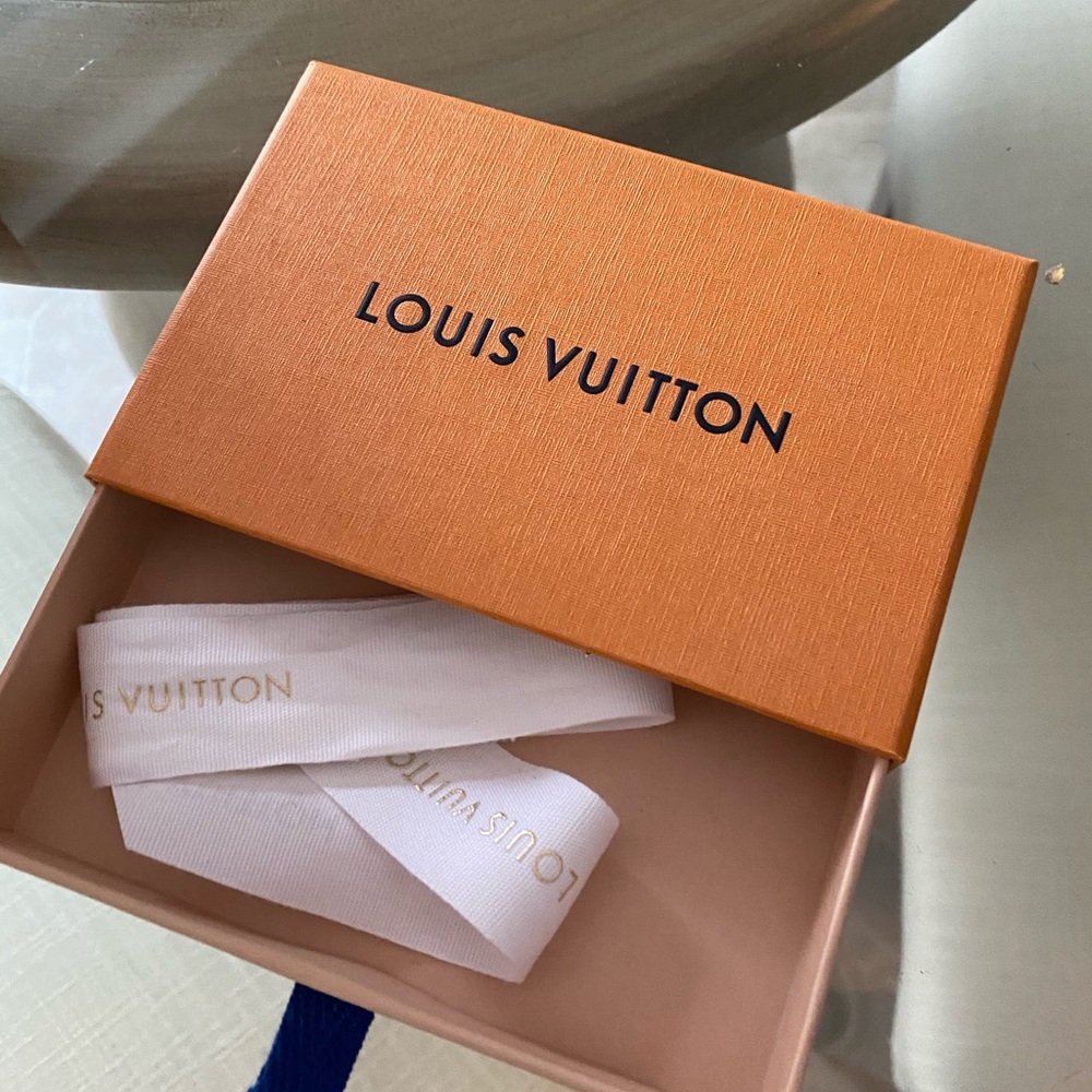 Louis Vuitton gift box, ribbon and gift bag.